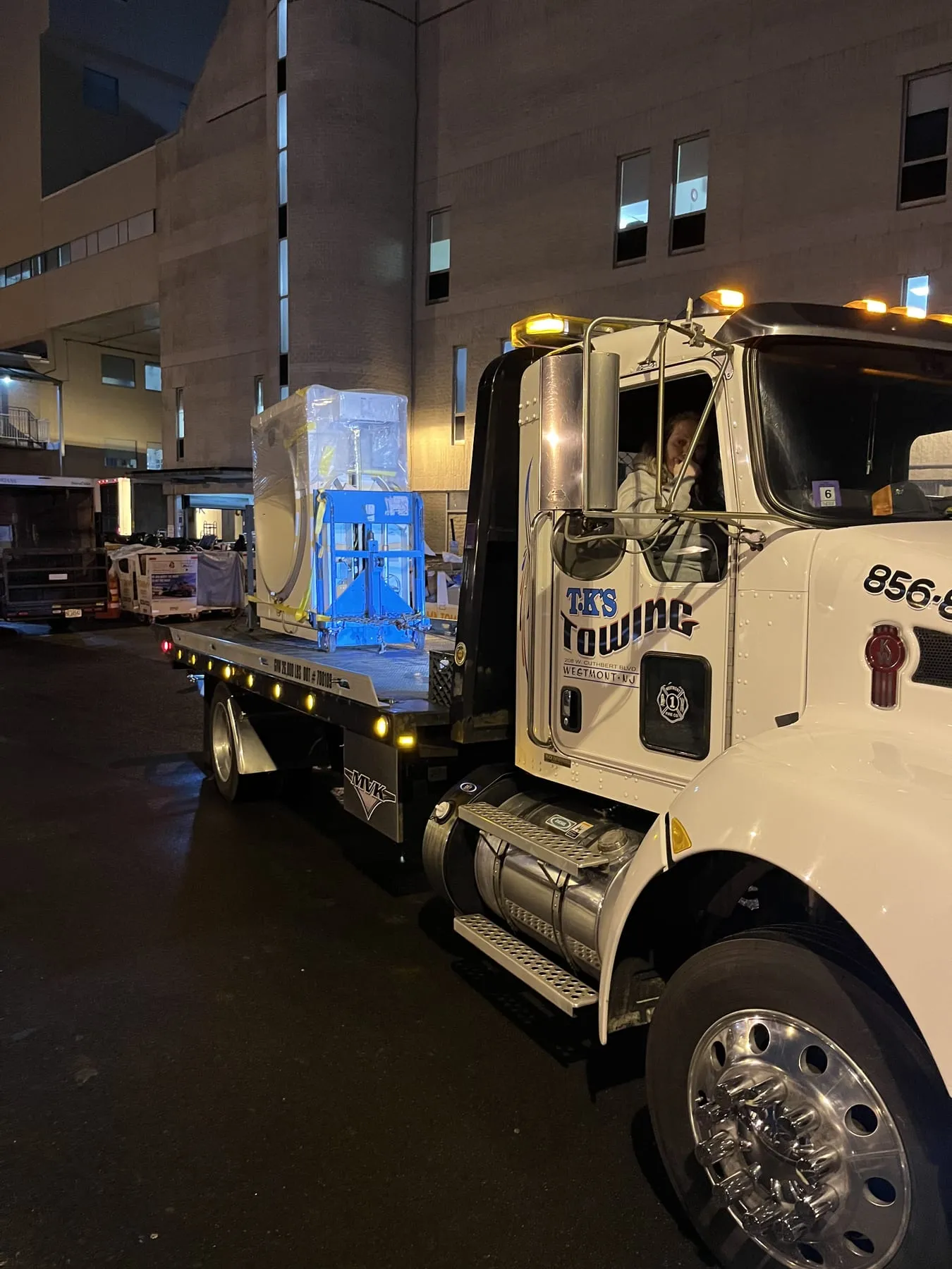 A night job at a hospital loading dock, truck lights on